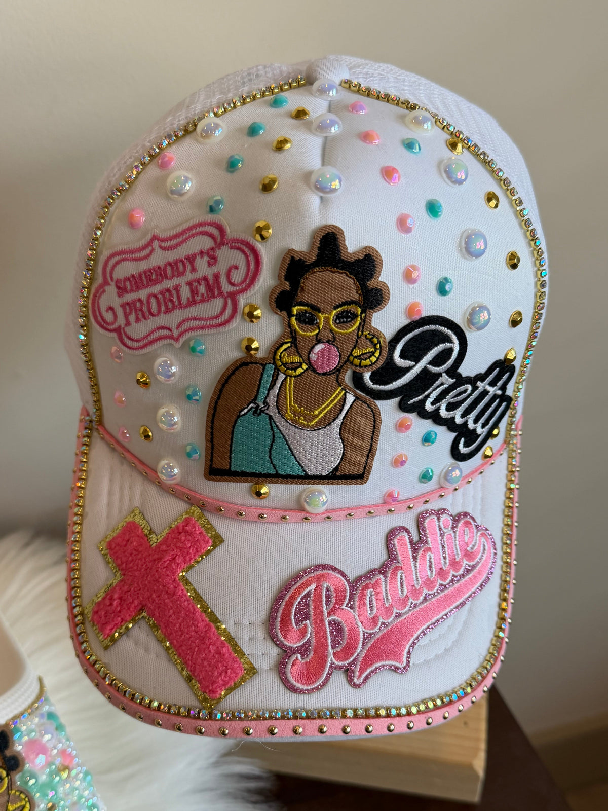 SOMEBODY’S PROBLEM MINT & BUBBLEGUM TRUCKER HAT