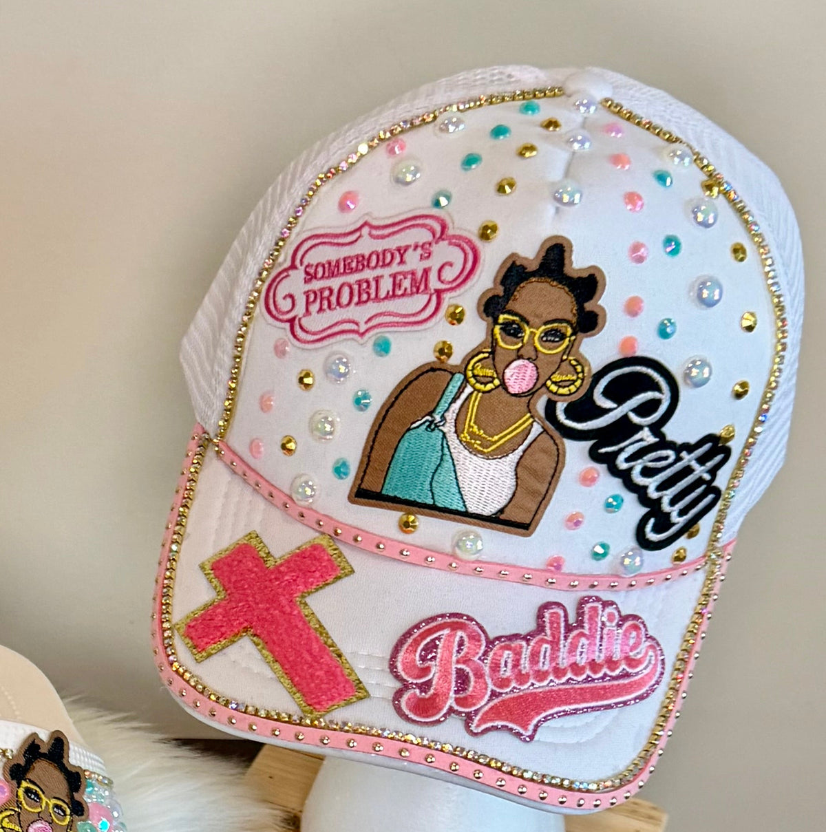 SOMEBODY’S PROBLEM MINT & BUBBLEGUM TRUCKER HAT