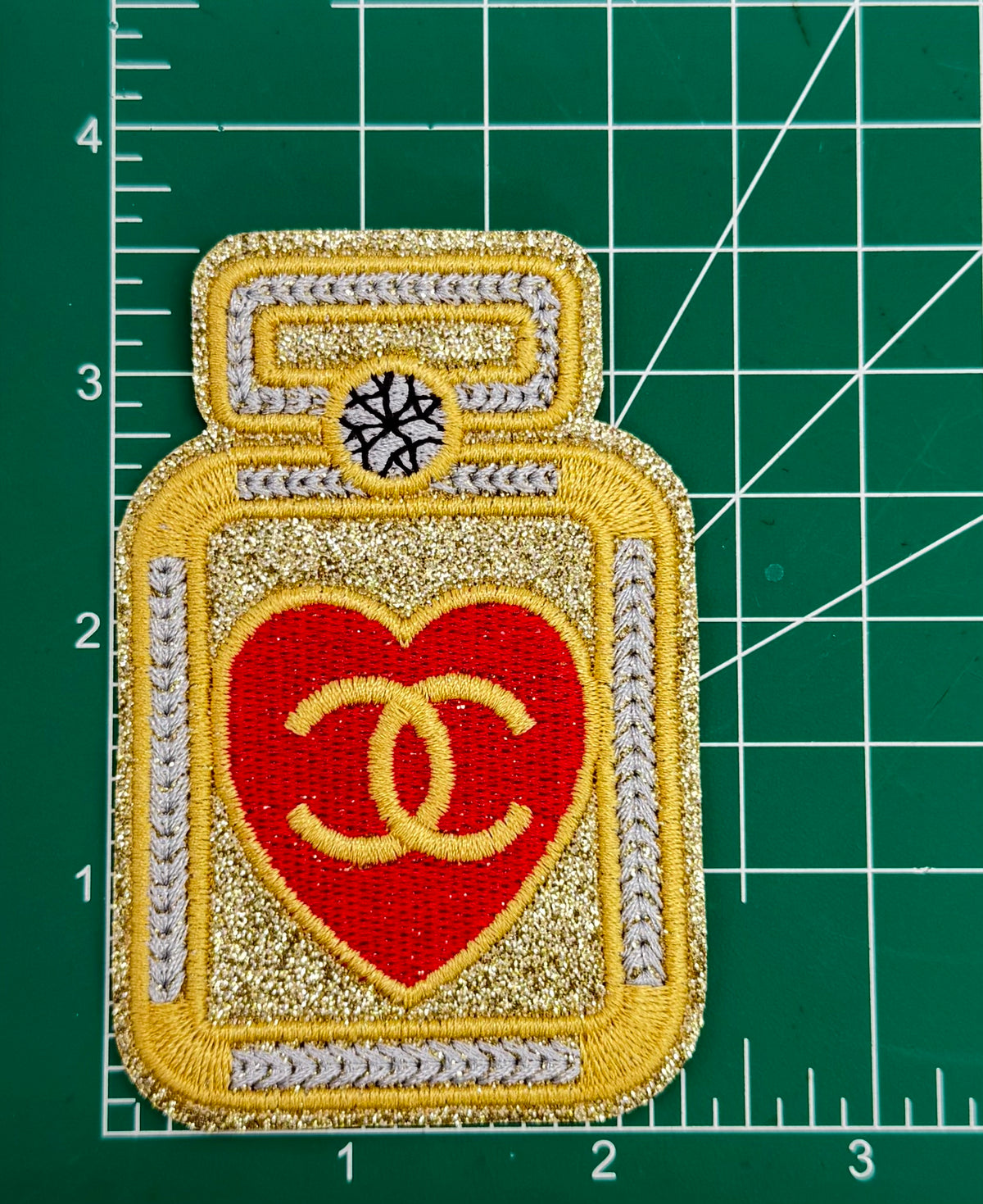 6PC “CHANEL” RED/GLD Patch/brooch set